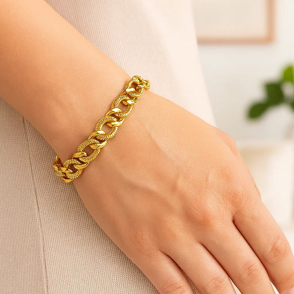 14k yellow gold curb chain bracelet featuring elegant diamond cuts, showcasing a luxurious design and refined craftsmanship.