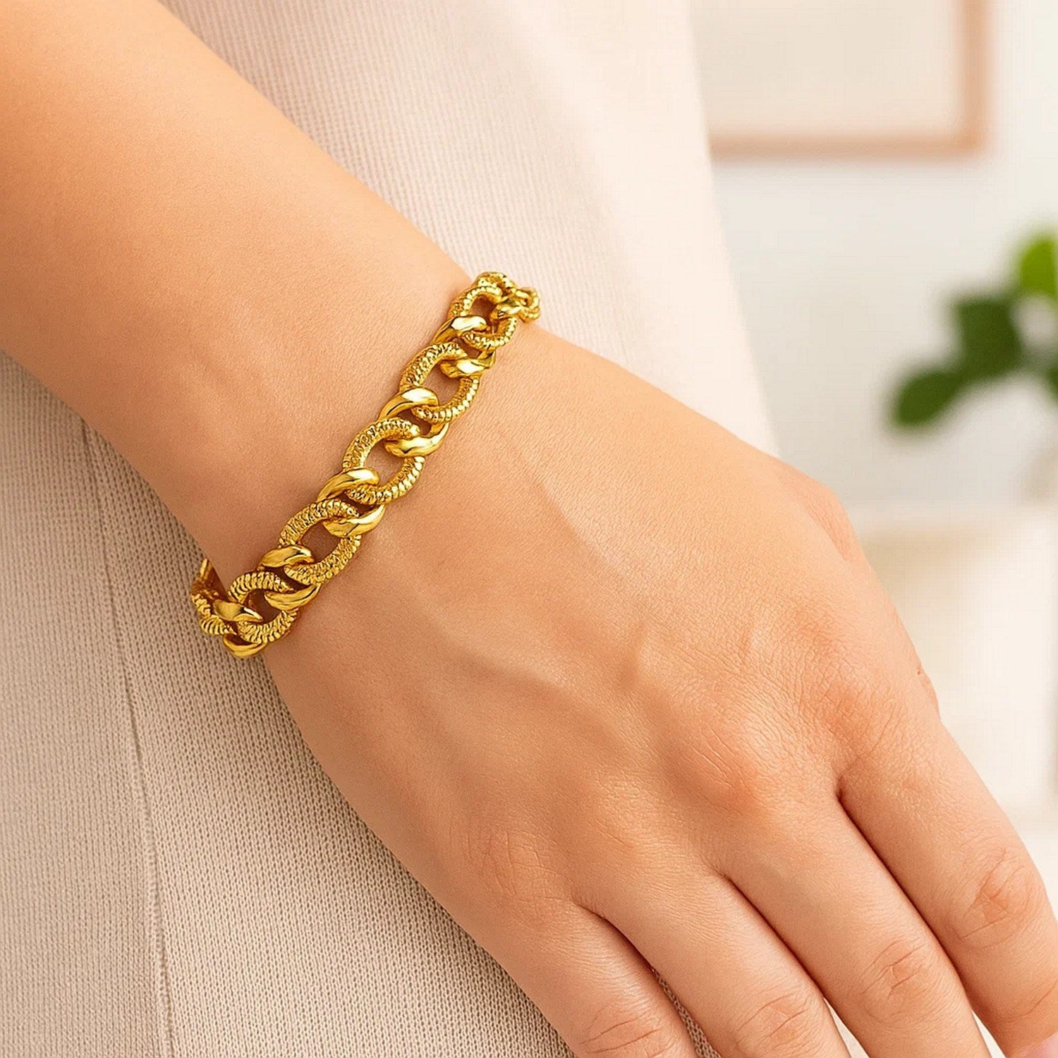 14k yellow gold curb chain bracelet featuring elegant diamond cuts, showcasing a luxurious design and refined craftsmanship.