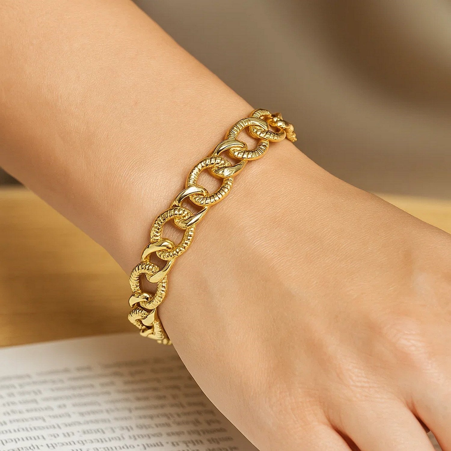 14k yellow gold curb chain bracelet with diamond cuts, elegantly designed for luxurious style and sophistication.