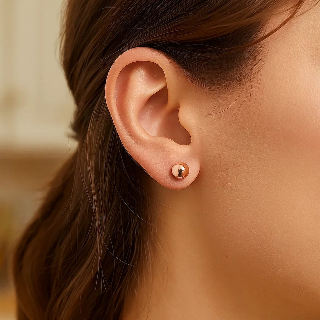 14k rose gold classic round stud earrings showcasing timeless elegance and refined craftsmanship.