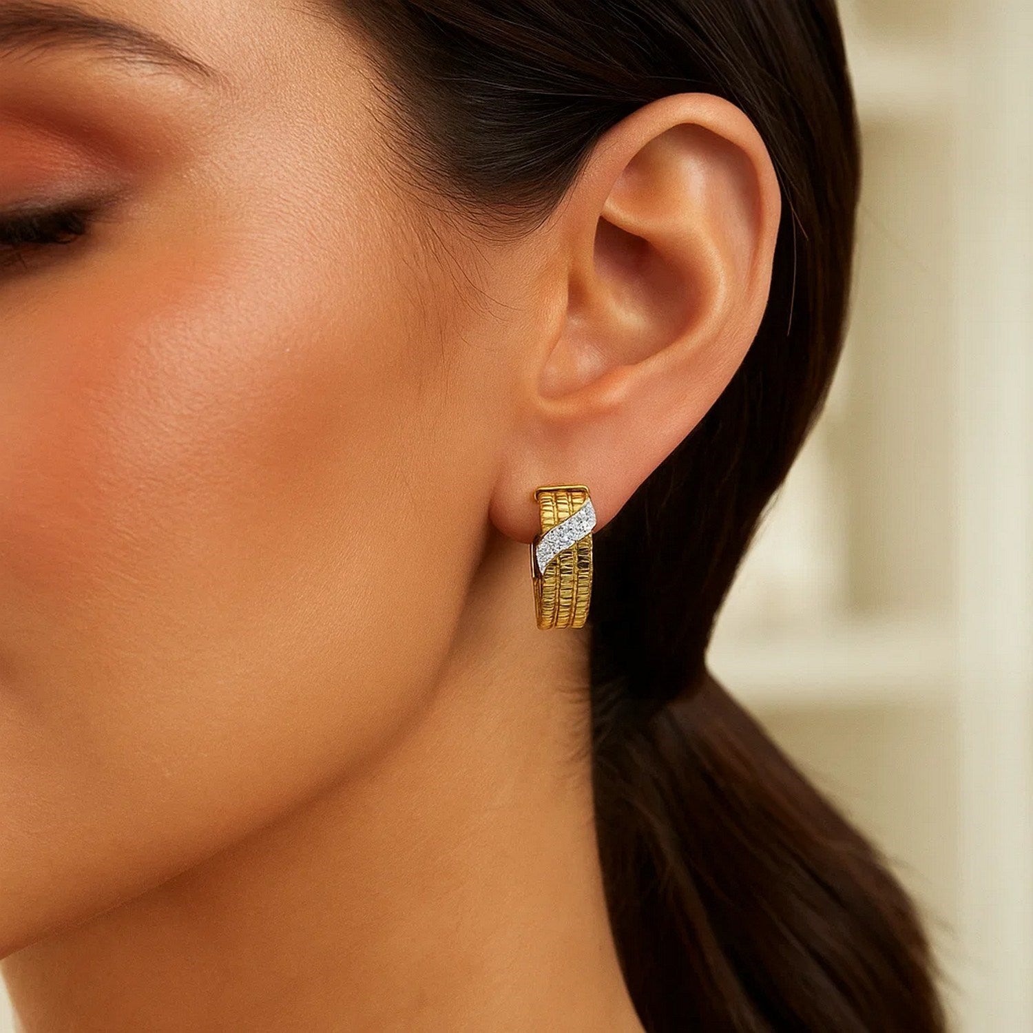 14K yellow gold triple row diamond hoop earrings showcasing a modern design with exquisite sparkle and elegance.