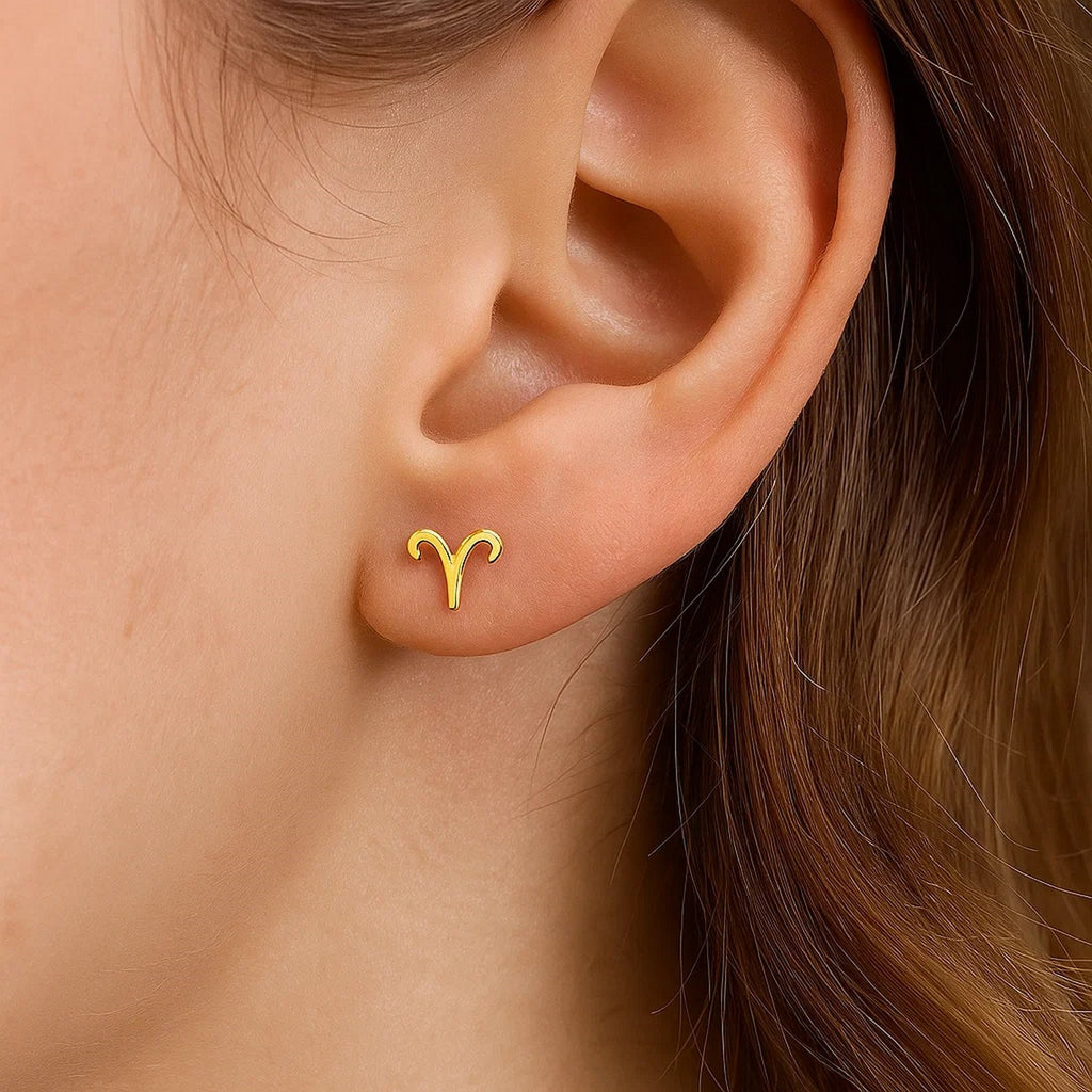 Elegant 14k yellow gold stud earrings featuring a refined minimalist design, perfect for sophisticated occasions.