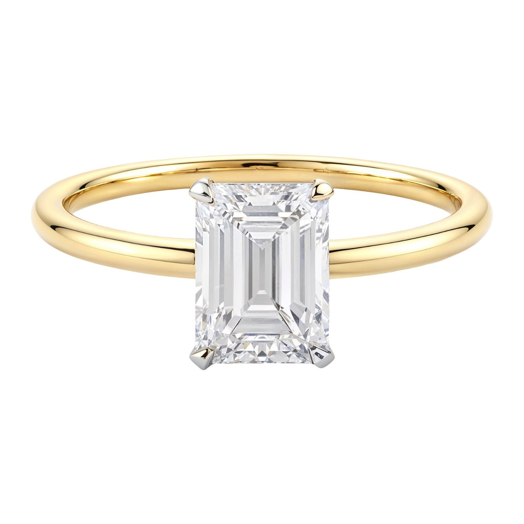 1.50Ct emerald lab-grown diamond ring in 10K yellow gold, featuring a contemporary bezel setting for a luxurious touch.