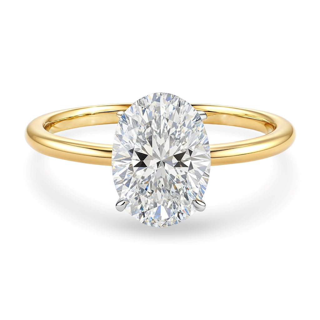 2 carat oval lab-grown diamond solitaire ring in 10K yellow gold, showcasing modern elegance and timeless beauty.