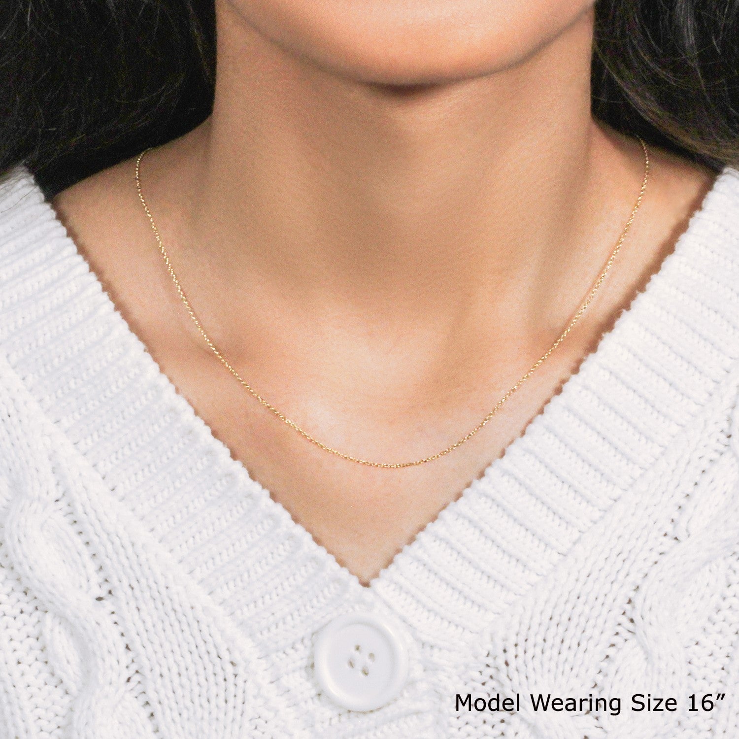 Elegant 10k yellow gold diamond cut cable link chain, featuring delicate links and a refined design for luxury wear.