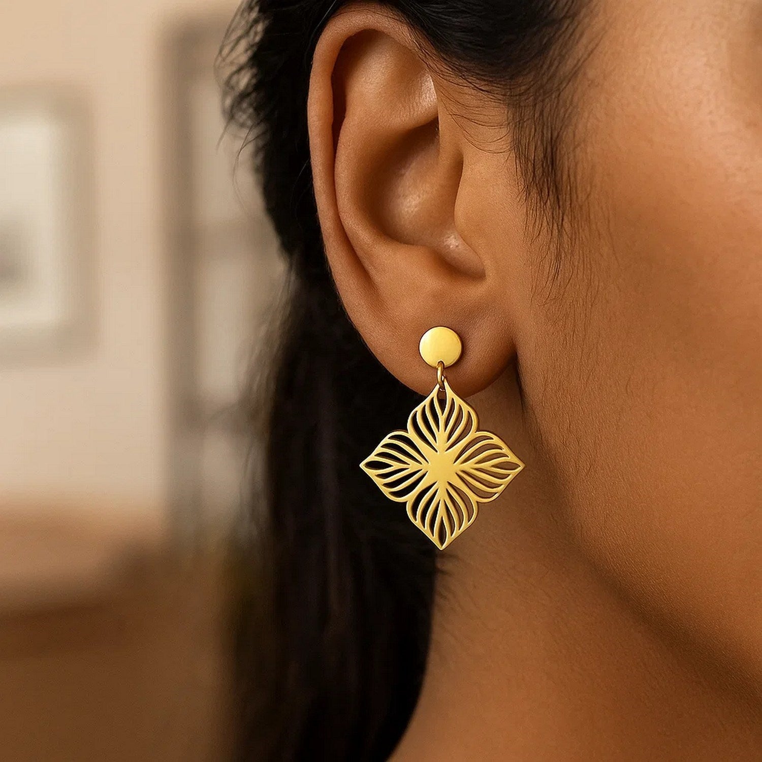 14k yellow gold high polish floral cutout dangle earrings exuding elegance and sophistication for any occasion.
