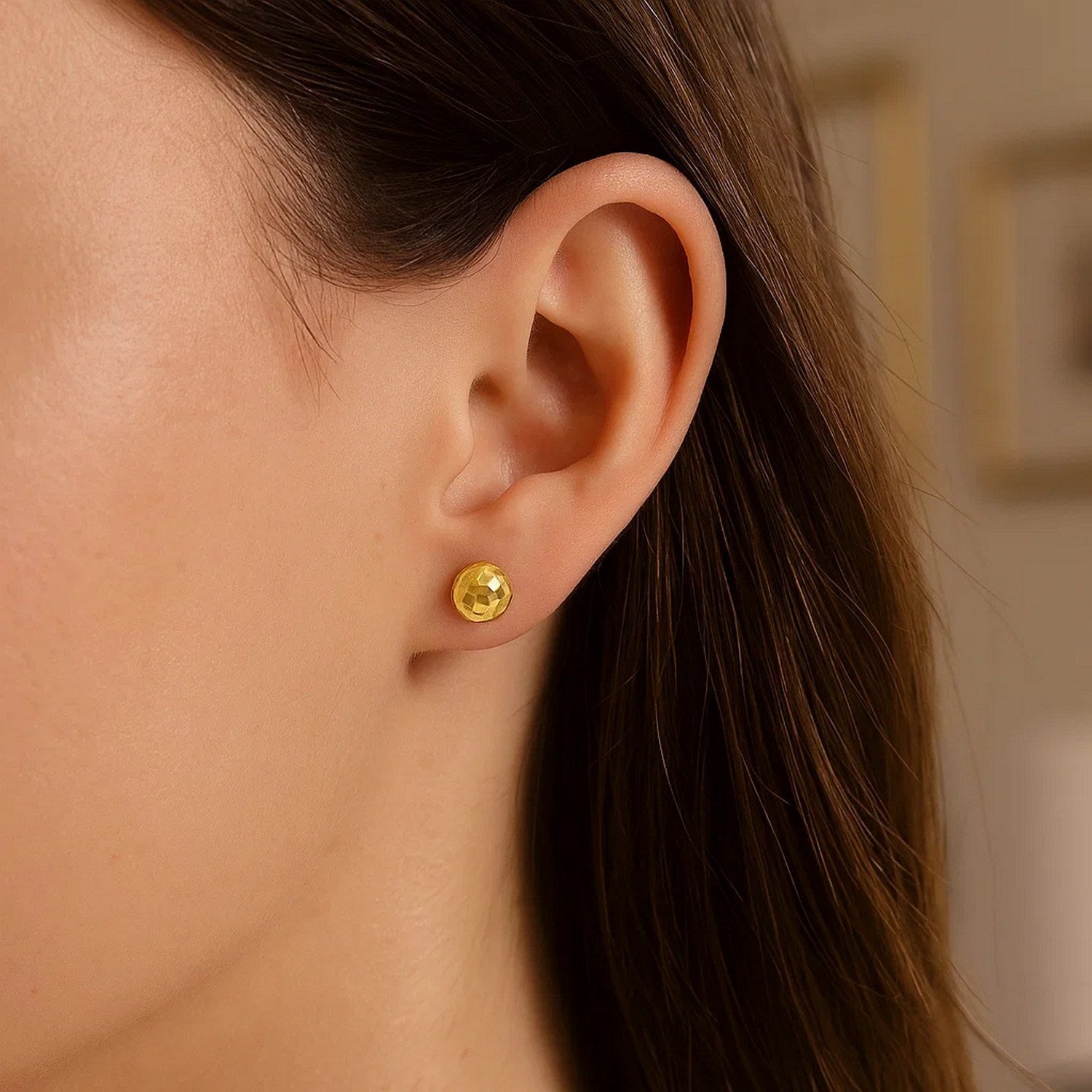 14k yellow gold minimalist faceted ball stud earrings showcasing elegant simplicity and timeless style.