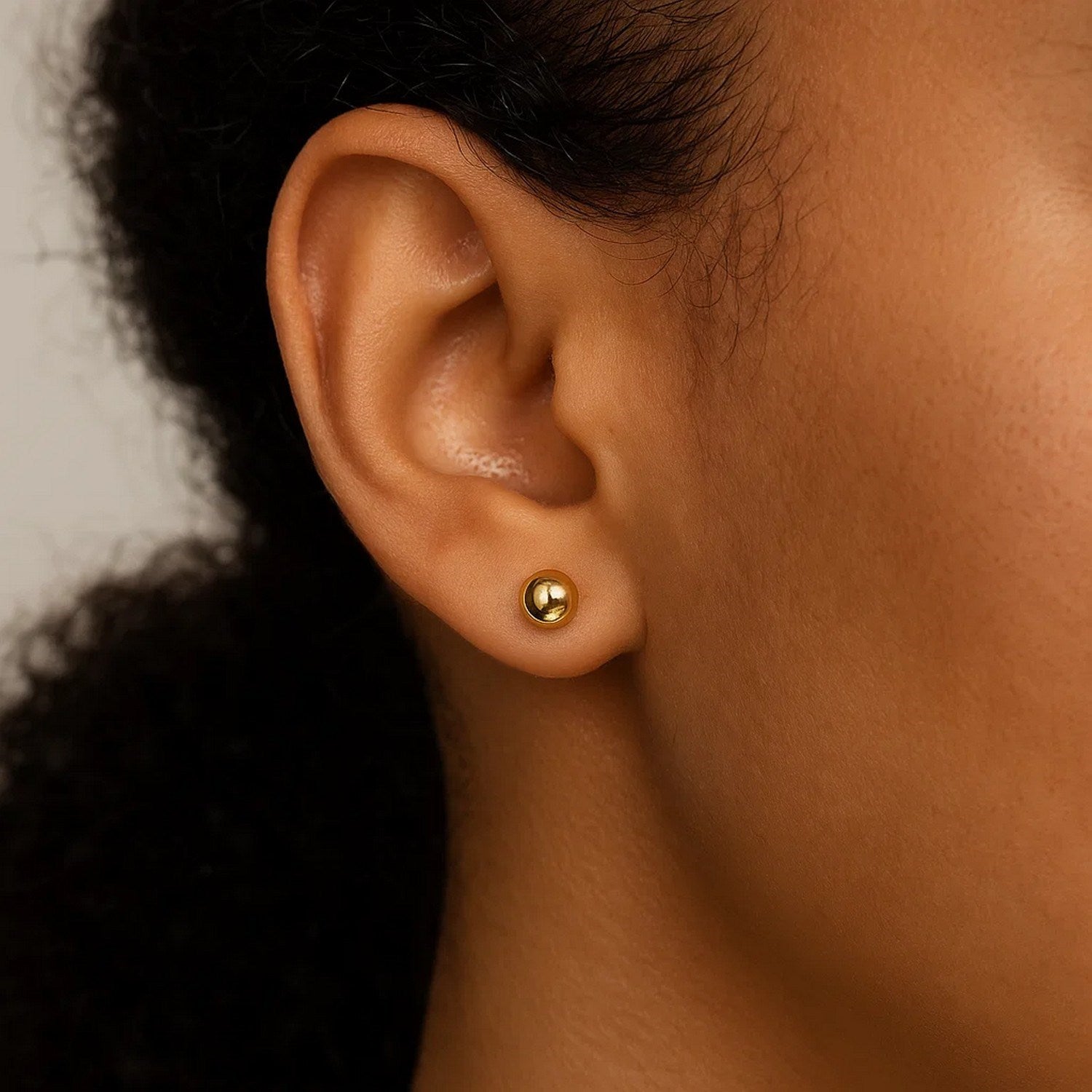 14k yellow gold classic round stud earrings, 5mm, showcasing timeless elegance and refined craftsmanship.