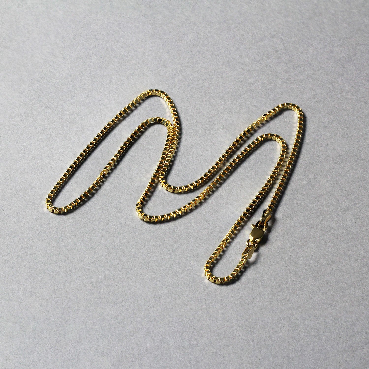 14k yellow gold classic box chain, modern design, 1.40 mm width, perfect for layering or as a standalone piece.
