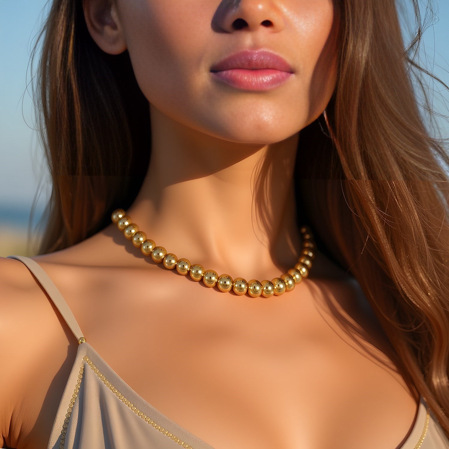 Contemporary 14k yellow gold bead chain necklace featuring 8mm polished beads for a luxurious statement look.