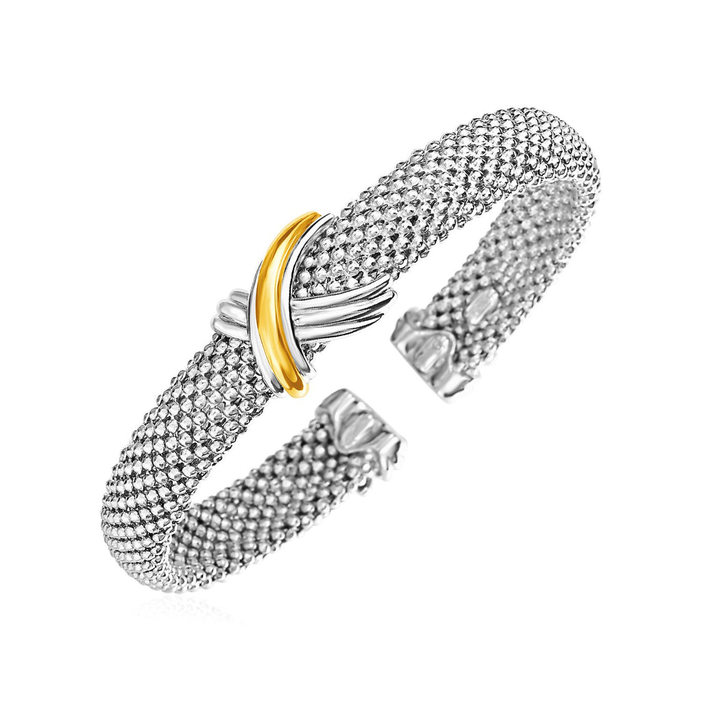 Sterling silver cuff bangle with elegant popcorn texture and 18k yellow gold accents, perfect for luxury styling.