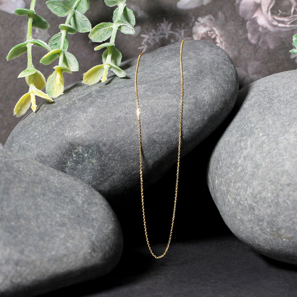 14k yellow gold diamond cut cable link chain featuring modern design and exquisite craftsmanship, perfect for layering.