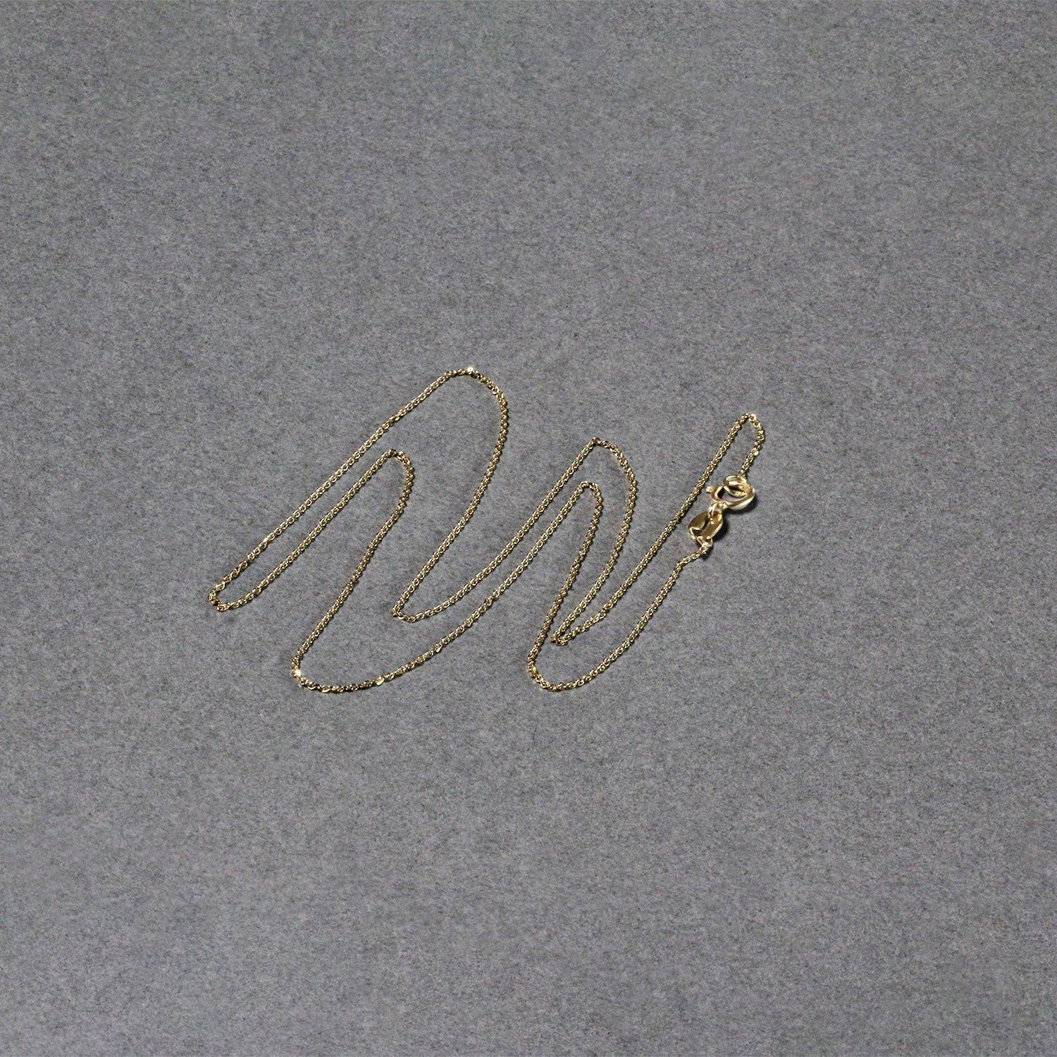 14k yellow gold diamond cut cable link chain, modern design with elegant round links, perfect for layering or solo wear.