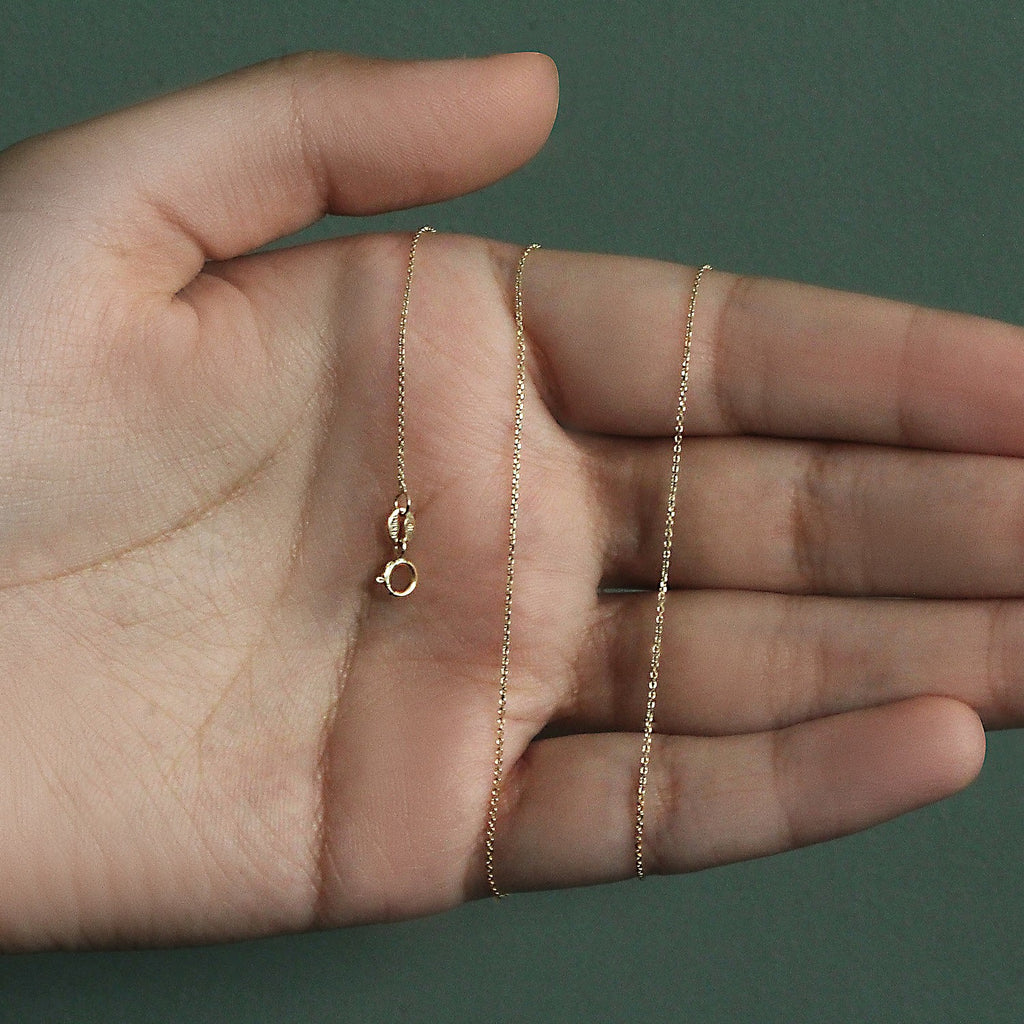 14k yellow gold diamond cut cable link chain, modern design with elegant round links, perfect for layering or solo wear.