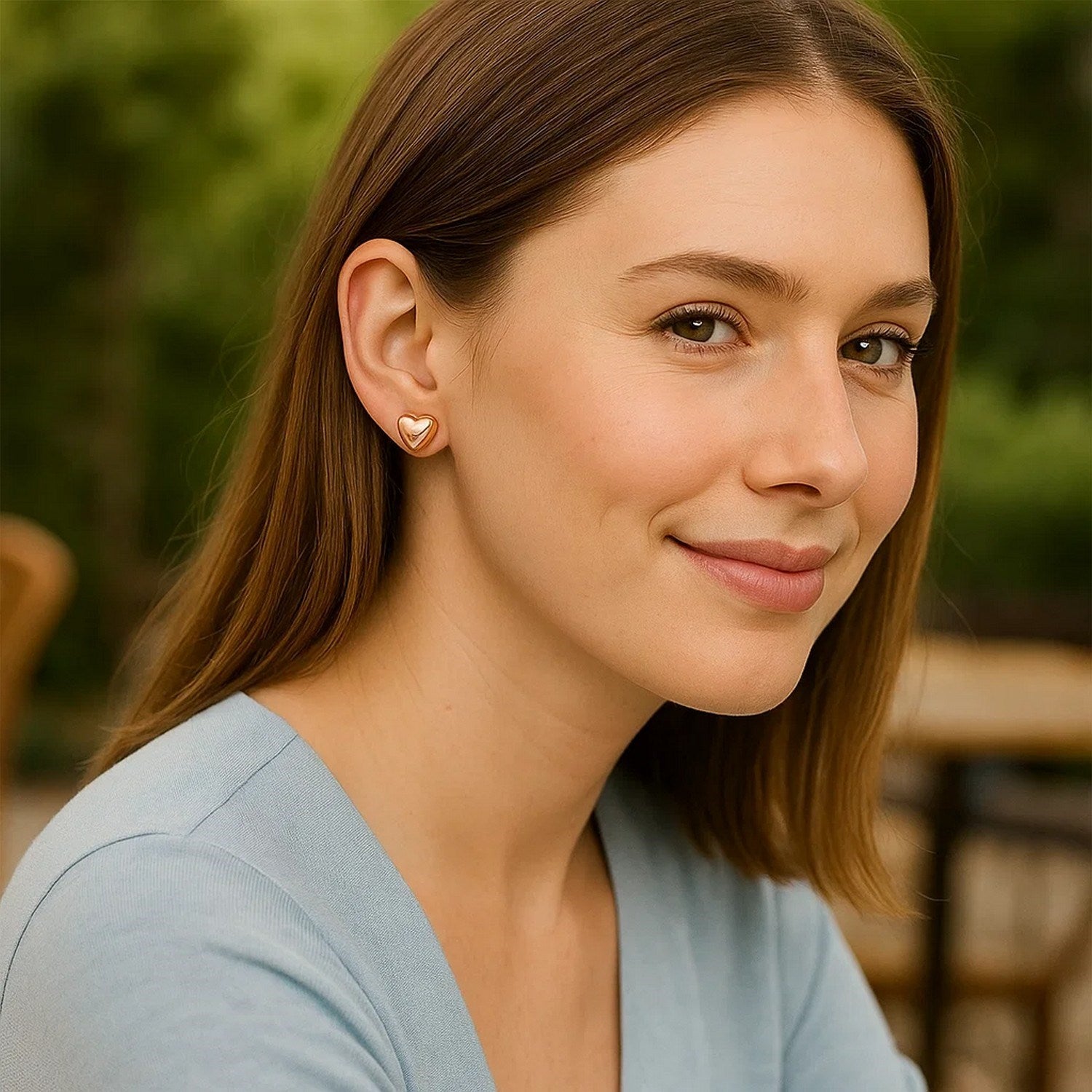 14k rose gold puffed heart shaped earrings with a contemporary design, exuding luxury and elegance.