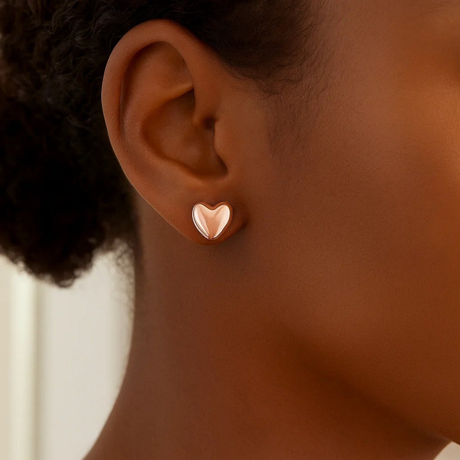 14k rose gold puffed heart shaped earrings with contemporary design, perfect for adding luxury to any outfit.