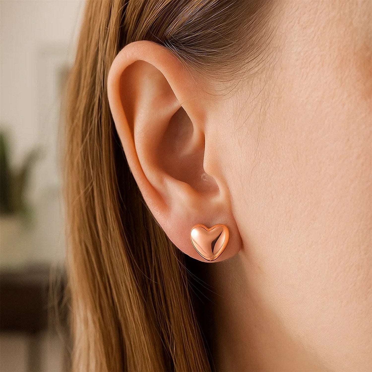 14k rose gold puffed heart shaped earrings with contemporary design, perfect for adding luxury to any outfit.