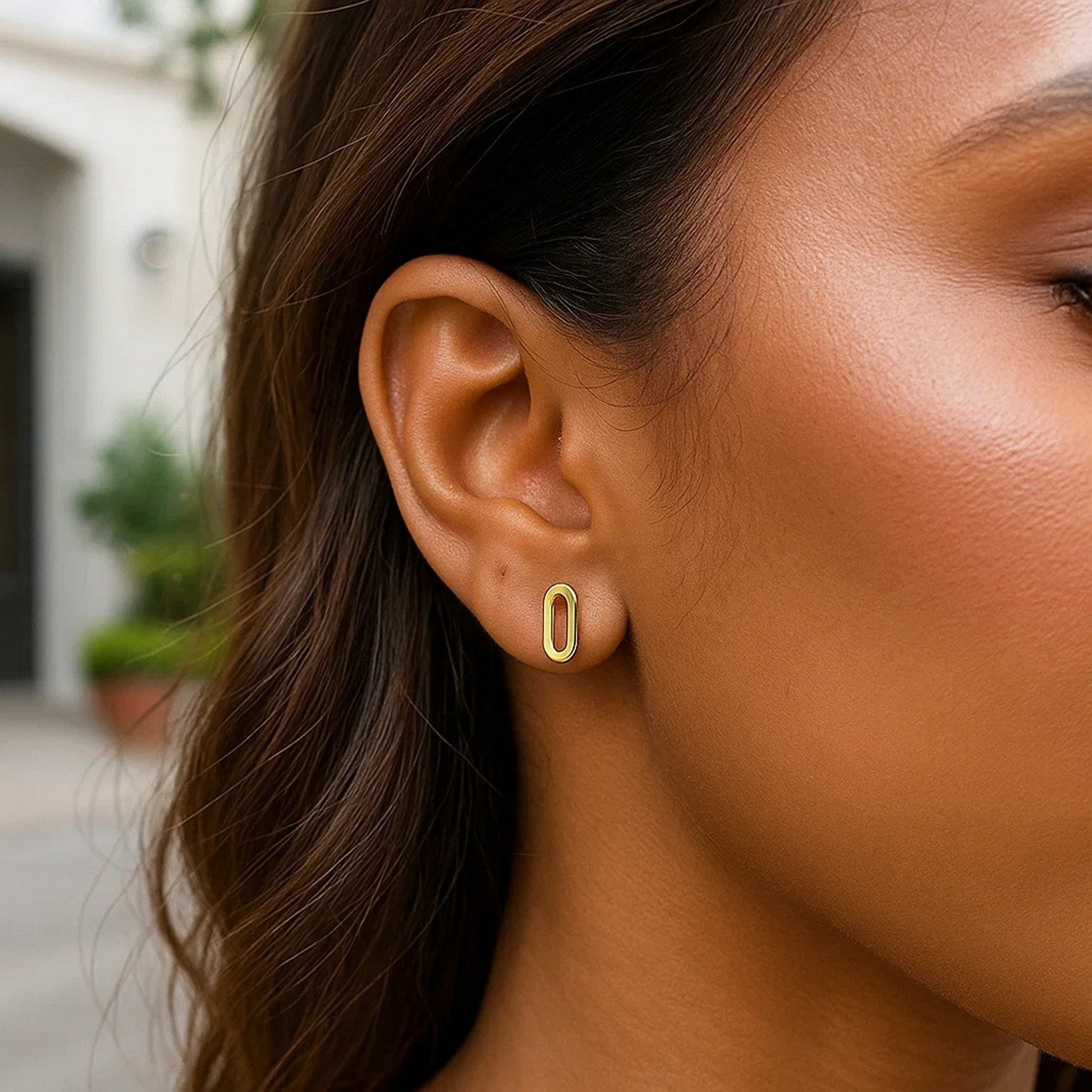 14k yellow gold paperclip link stud earrings with a modern design, showcasing a sleek and elegant chain style.