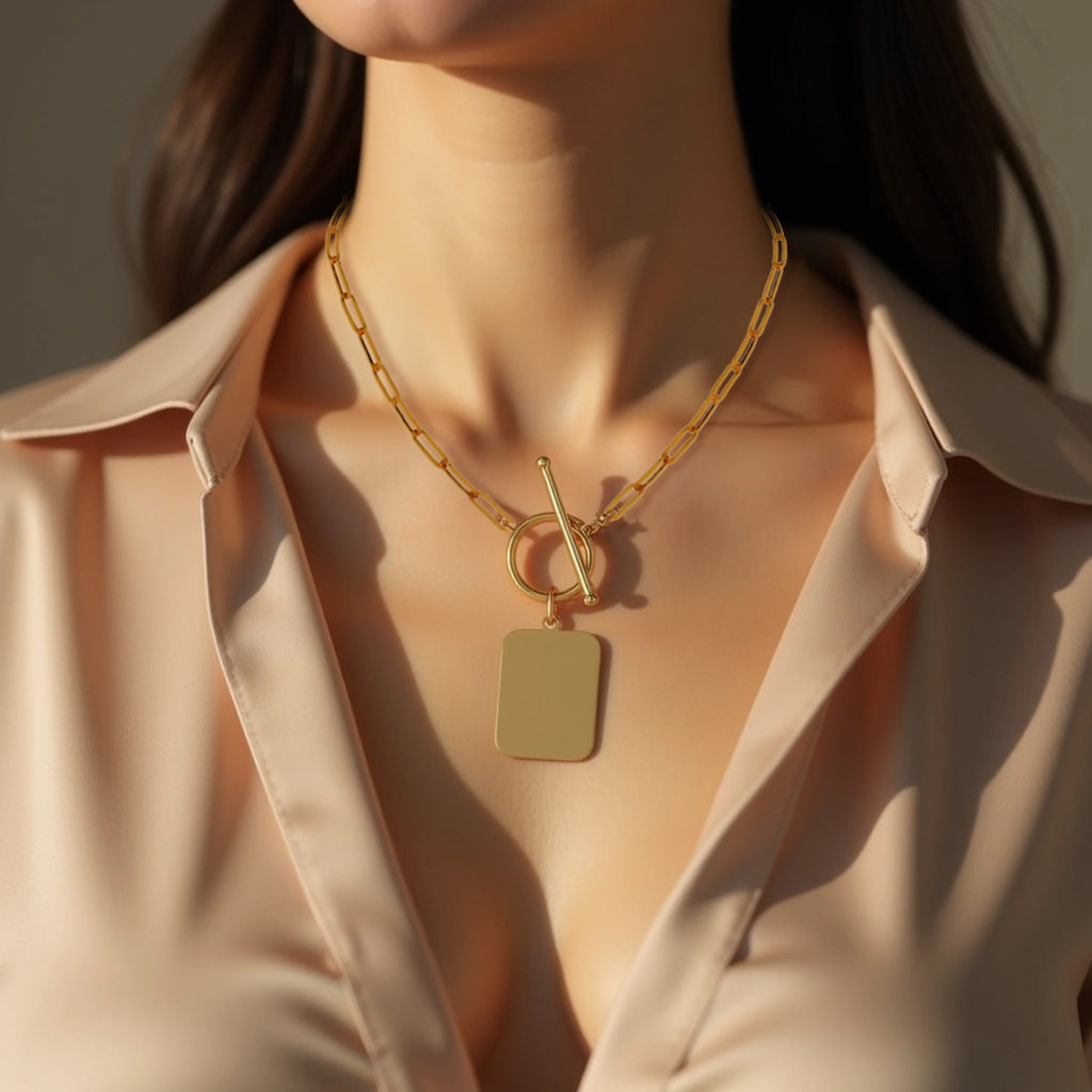 14k yellow gold paperclip chain necklace featuring a modern rounded rectangle pendant for a chic, elegant look.