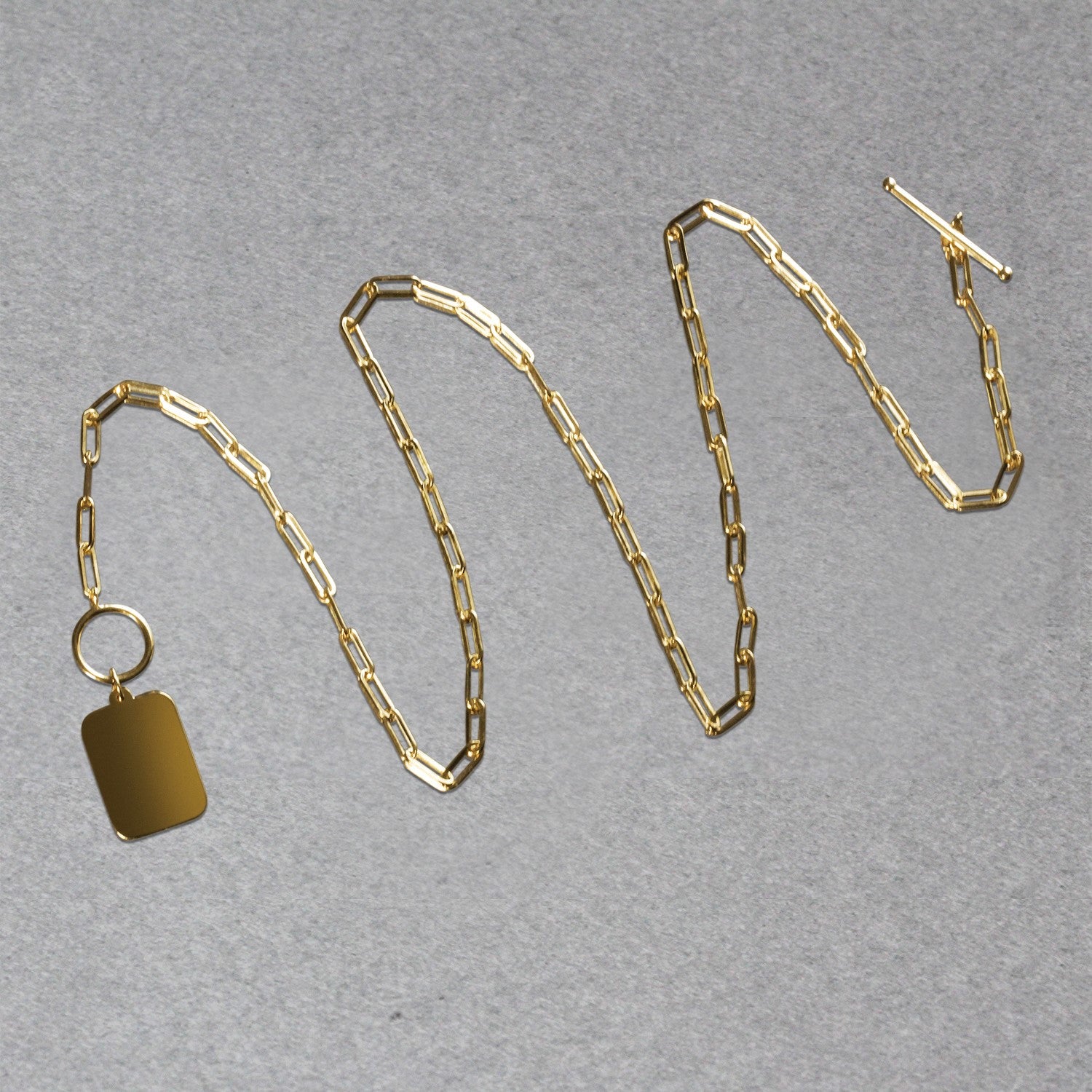 14k yellow gold paperclip chain necklace featuring a modern rounded rectangle pendant for a chic, elegant look.