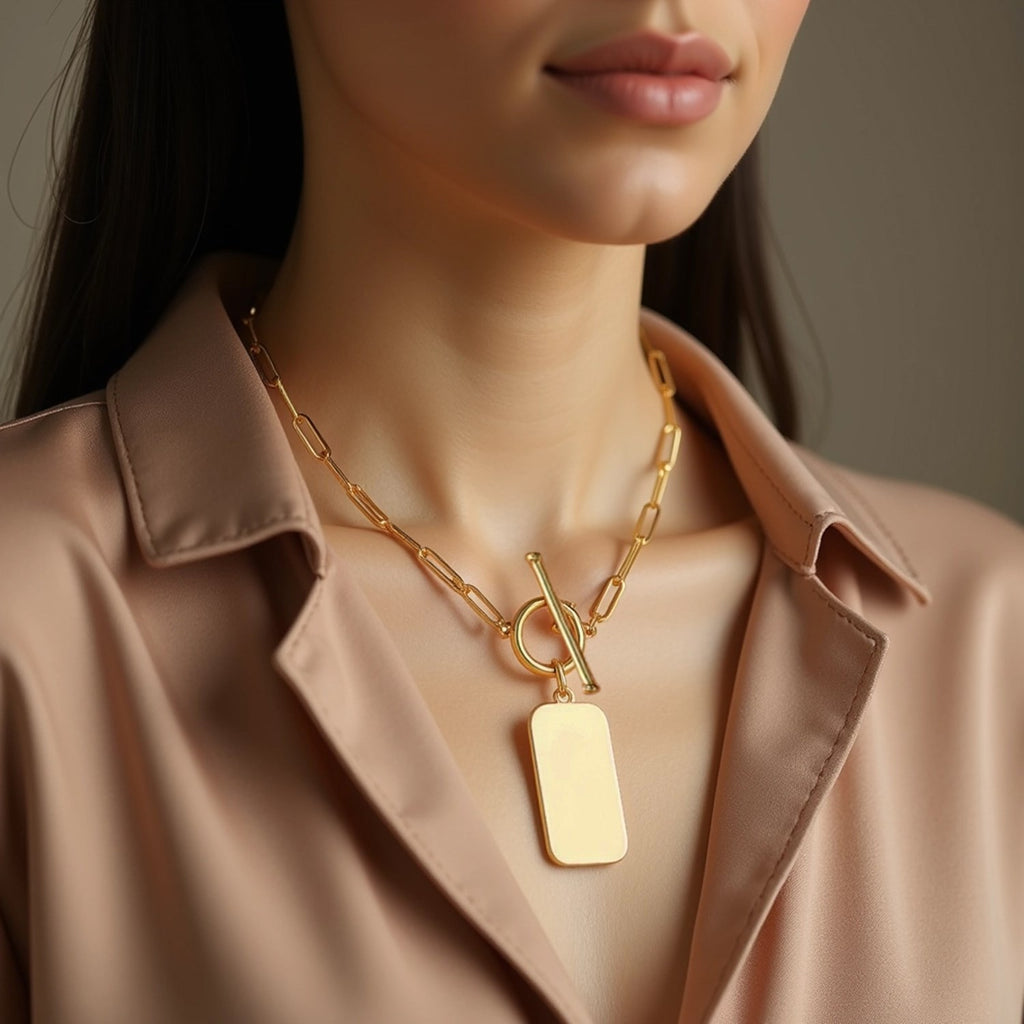 14k yellow gold paperclip chain necklace featuring a modern rounded rectangle pendant for a chic, sophisticated look.