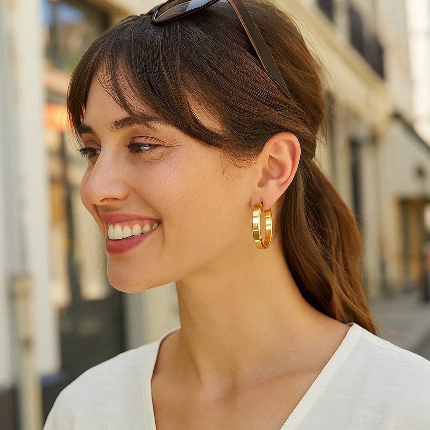 14K yellow gold large tube hoop earrings with a sleek modern design, perfect for elevating any luxury jewelry collection.