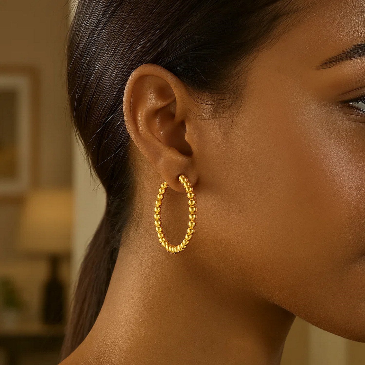 14k yellow gold polished large bead hoop earrings, elegantly designed for a luxurious statement.