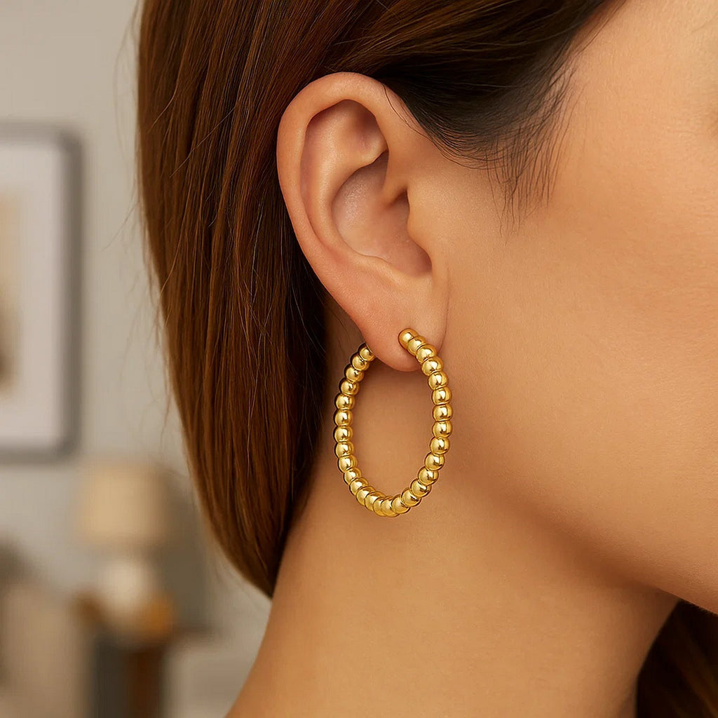 14K yellow gold polished large bead hoop earrings, exuding elegance with a timeless design and luxurious shine.
