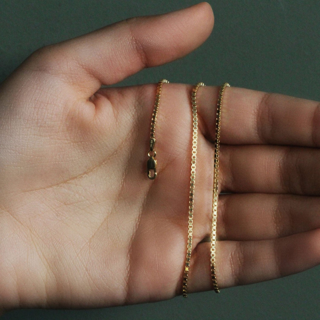 14k yellow gold classic box chain, 1.7 mm, showcasing timeless elegance and luxurious craftsmanship.