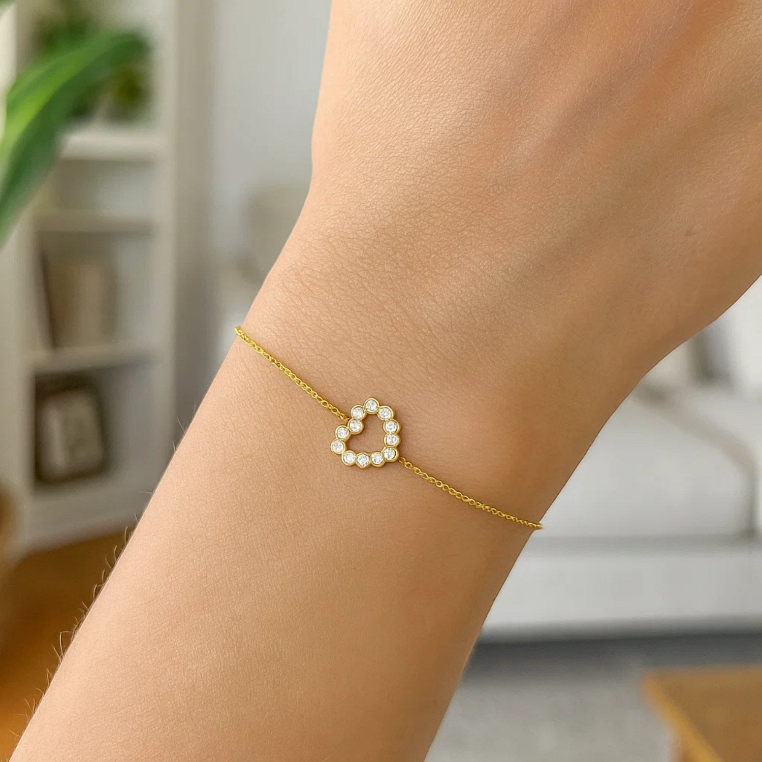 Elegant 14k yellow gold petite diamond heart bracelet featuring a delicate chain design, perfect for refined occasions.