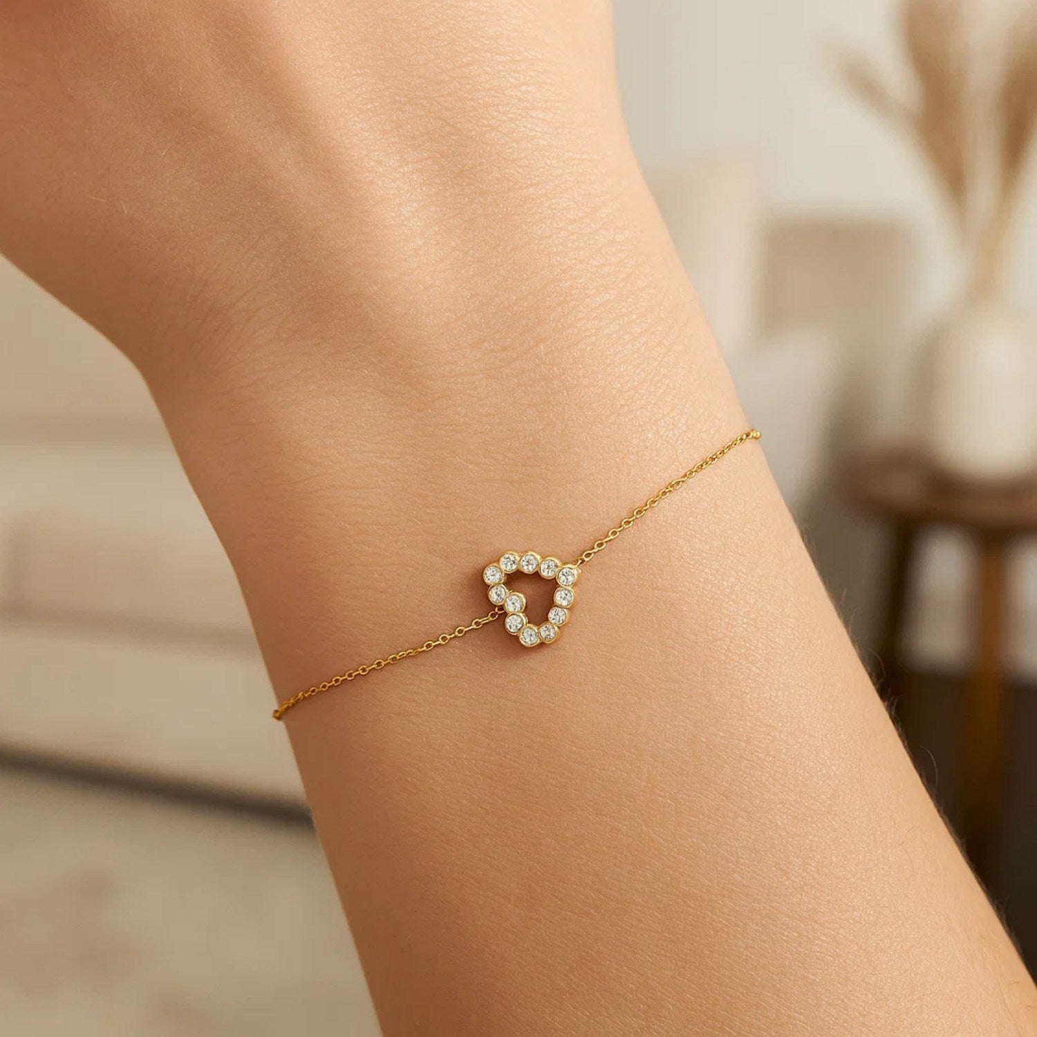 Elegant 14k yellow gold petite diamond heart bracelet with a delicate chain design, perfect for refined luxury styling.