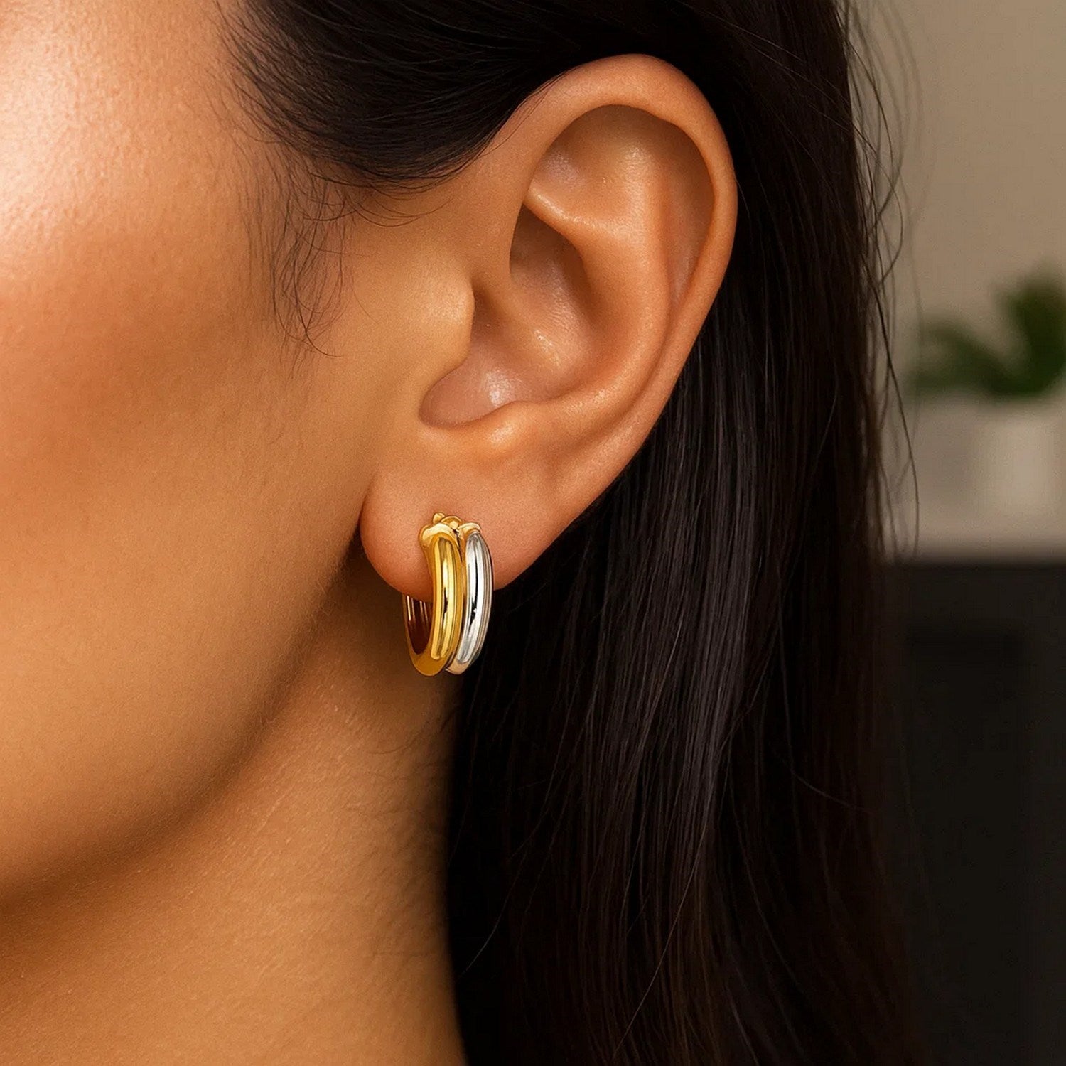 14k two-tone gold textured double hoop earrings with a modern design, perfect for elegant occasions.