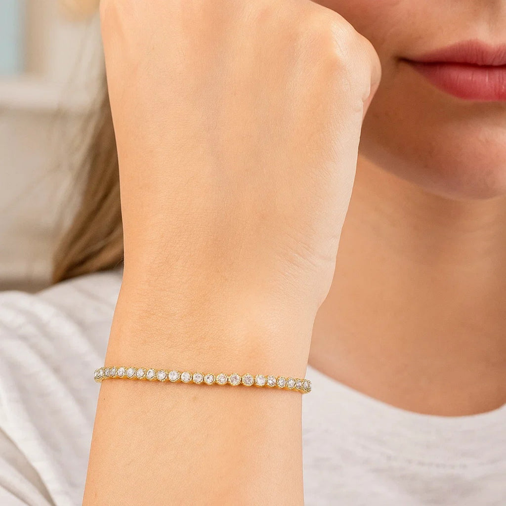 14K two-tone gold tennis bracelet featuring round diamonds, exuding elegance and sophistication in every detail.