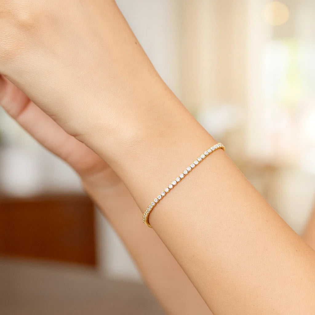 14K two-tone gold tennis bracelet featuring round diamonds, exuding elegance and luxury in every detail.