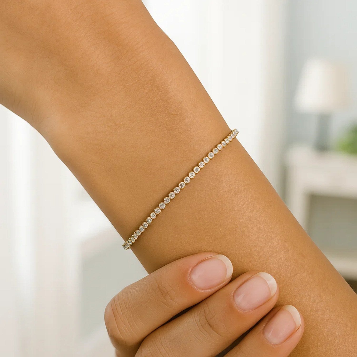 14K two-tone gold tennis bracelet featuring round diamonds, elegantly designed for timeless luxury.