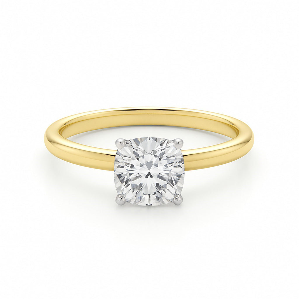 1 carat cushion cut diamond solitaire ring in 10K yellow gold, showcasing elegant simplicity and timeless luxury.